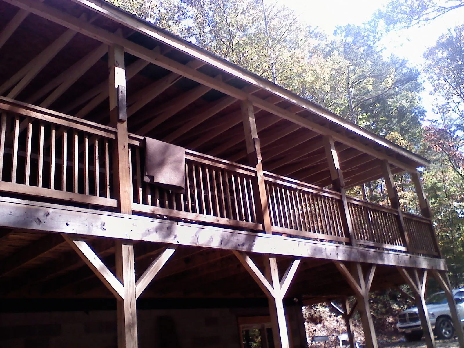 Timber framing under a new elevated porch and deck — Roof Leak Repair in New Hartford by Roofing Brothers